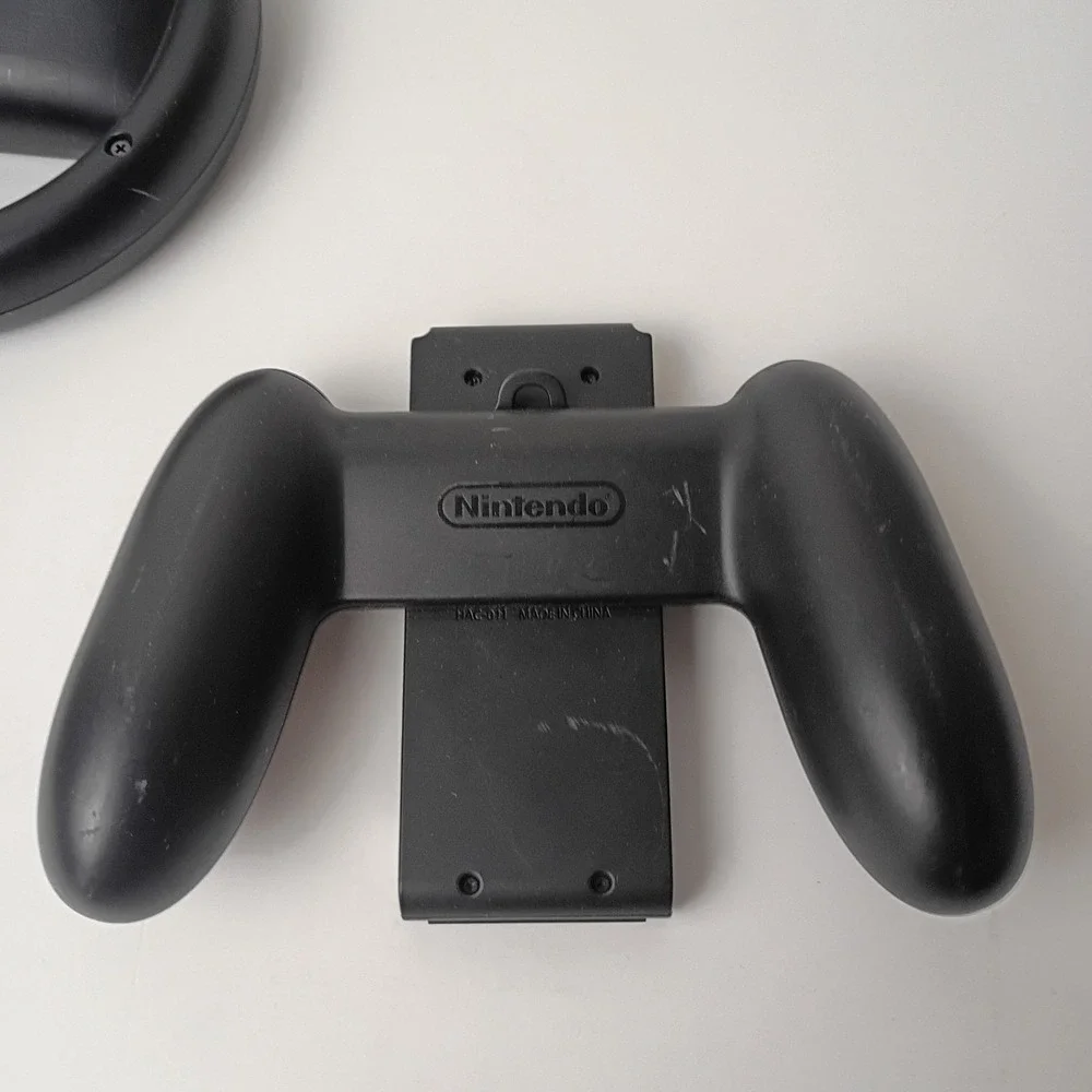 Nintendo Switch Game Accessories: 1 Steering Wheel and 2 Controller Grips